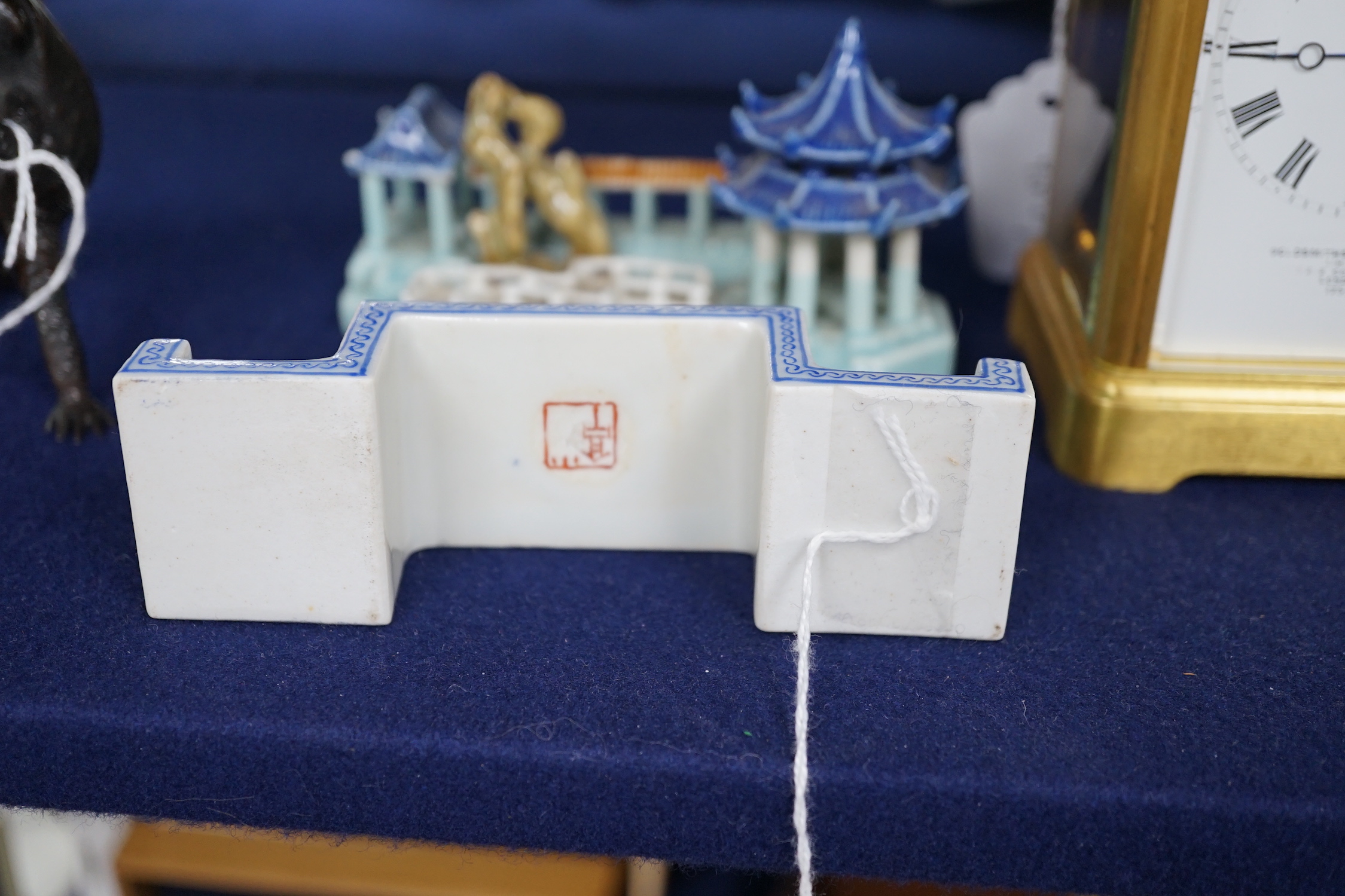 A Chinese model of pavilions and an enamelled porcelain ink stand, 12.5cm